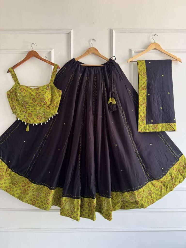 Lime printed strappy choli, navy skirt with lime printed border and matching dupatta on hangers